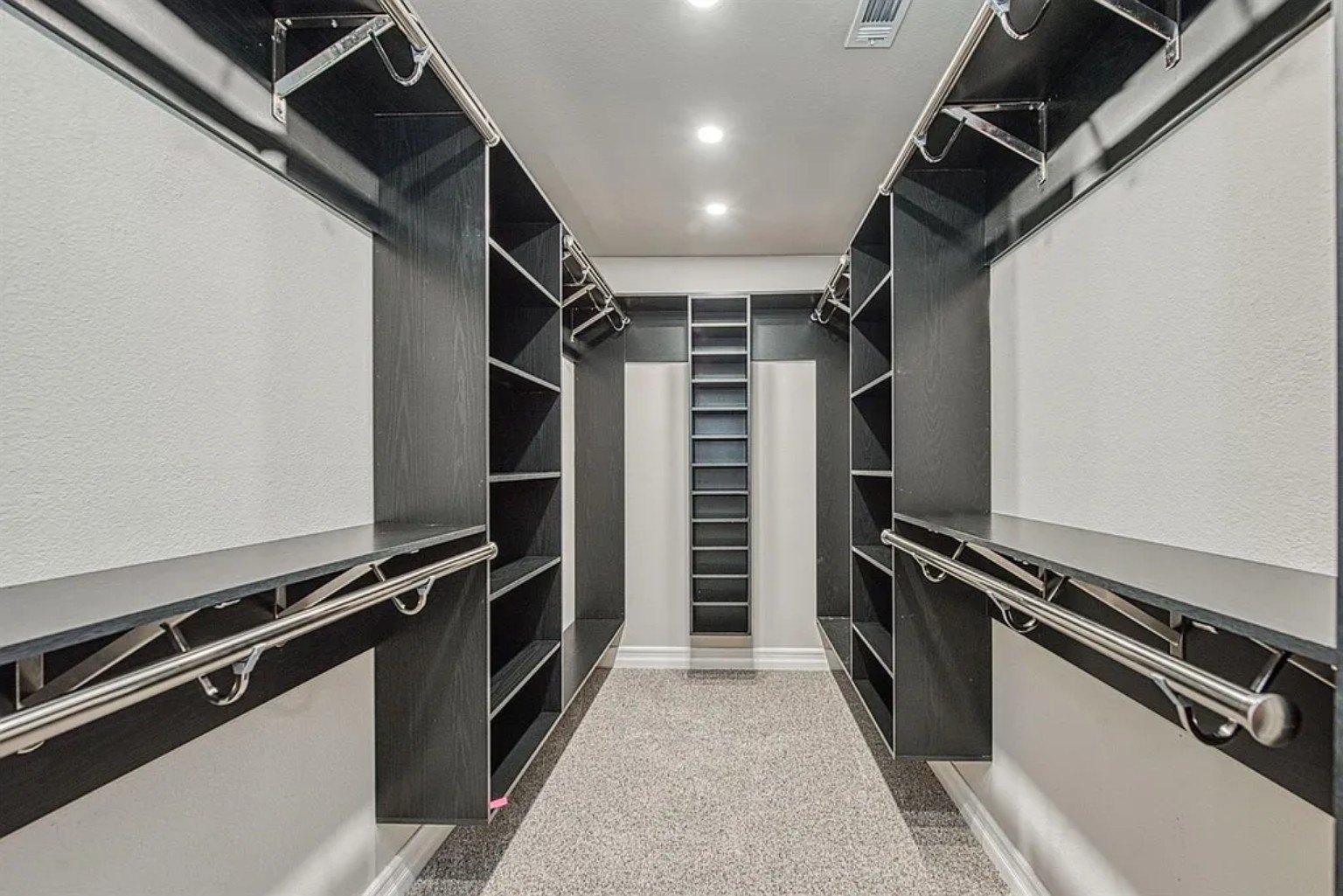 Finished walk-in closet with custom storage