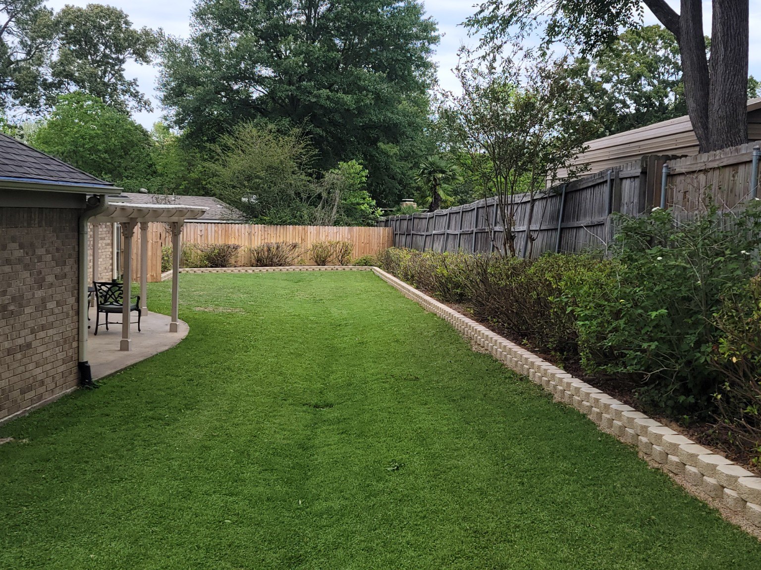 Wide view of a finished landscape retaining wall