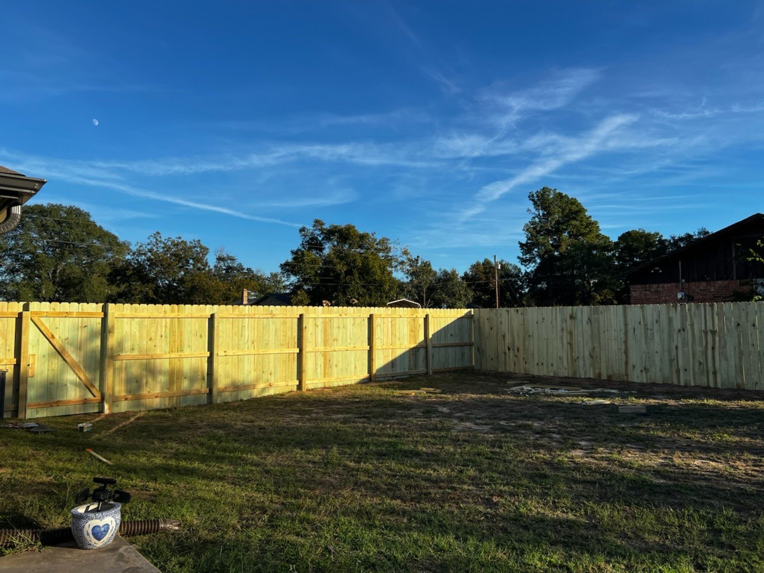 Wide view of a finished wood privacy fence