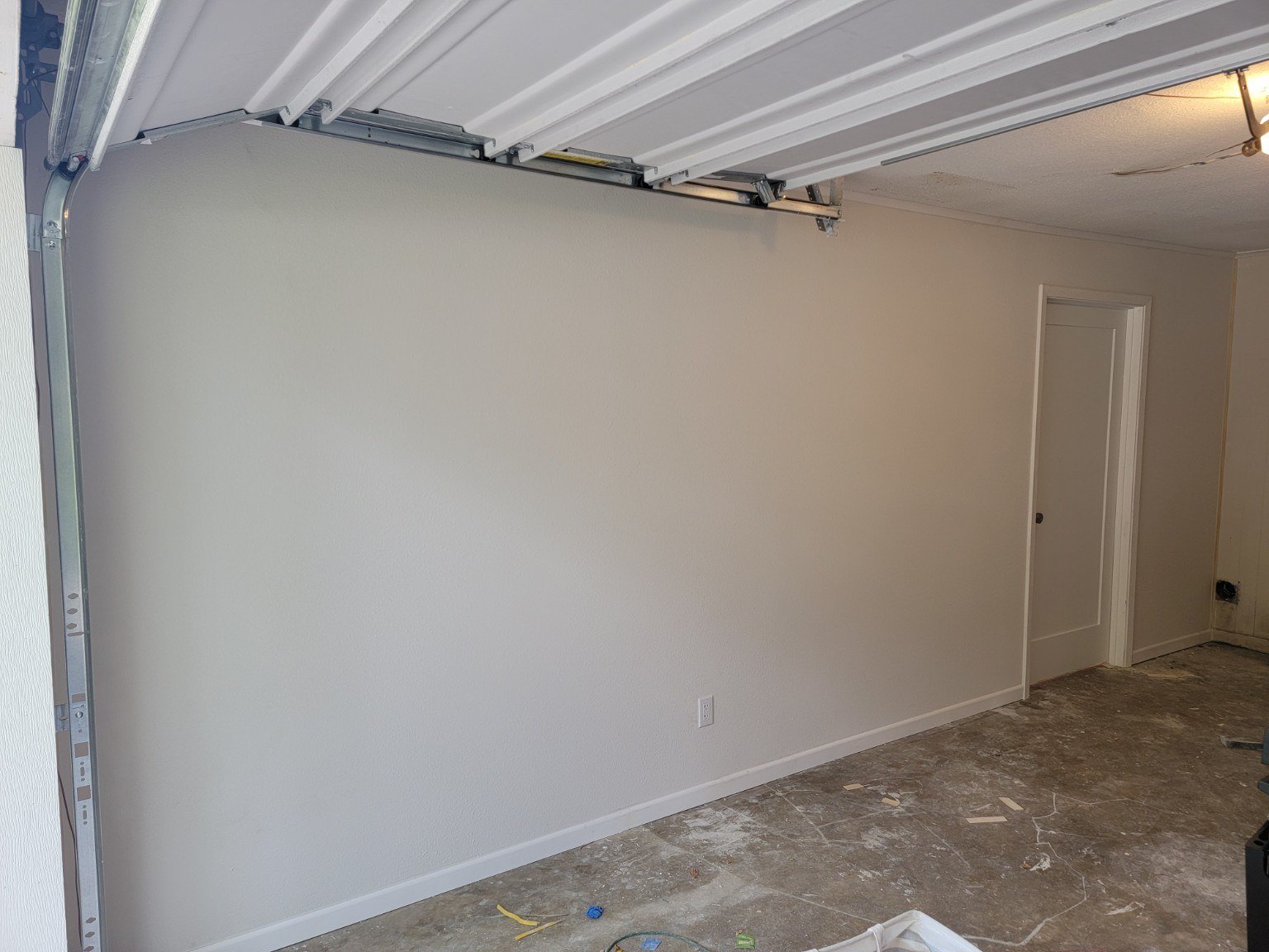 Finished interior space created through a garage conversion