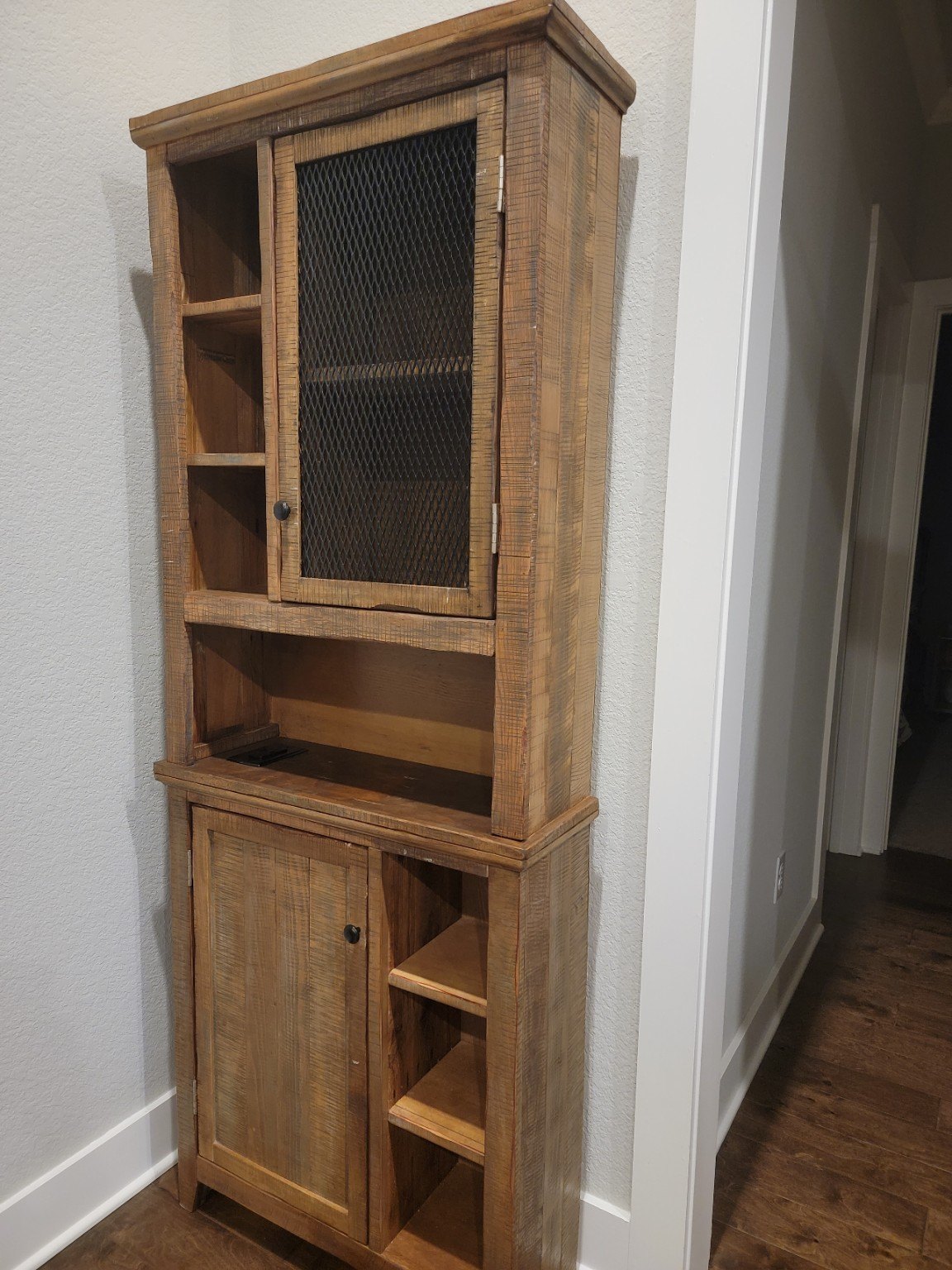 Rustic wood cabinet with doors and shelves