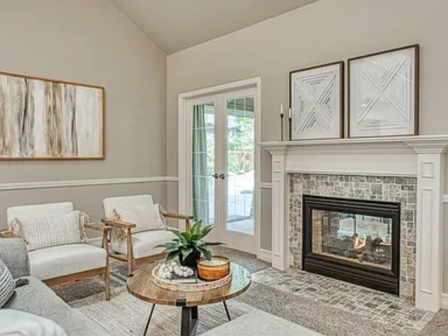 Finished living room with fireplace and television wall